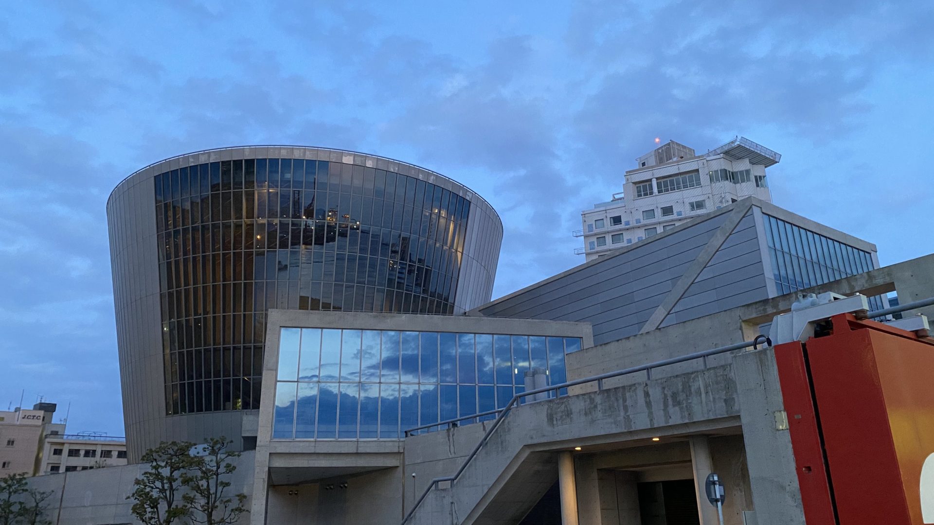 Glass-walled architecture at sunset time